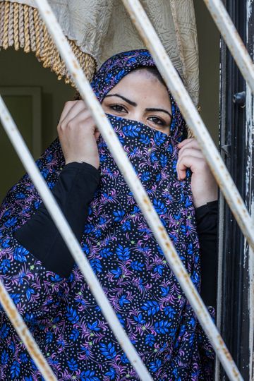 Portrait of a child bride in Al Mafraq, Jordan. Married off at the age of 14. Photo by Martin Thaulow.