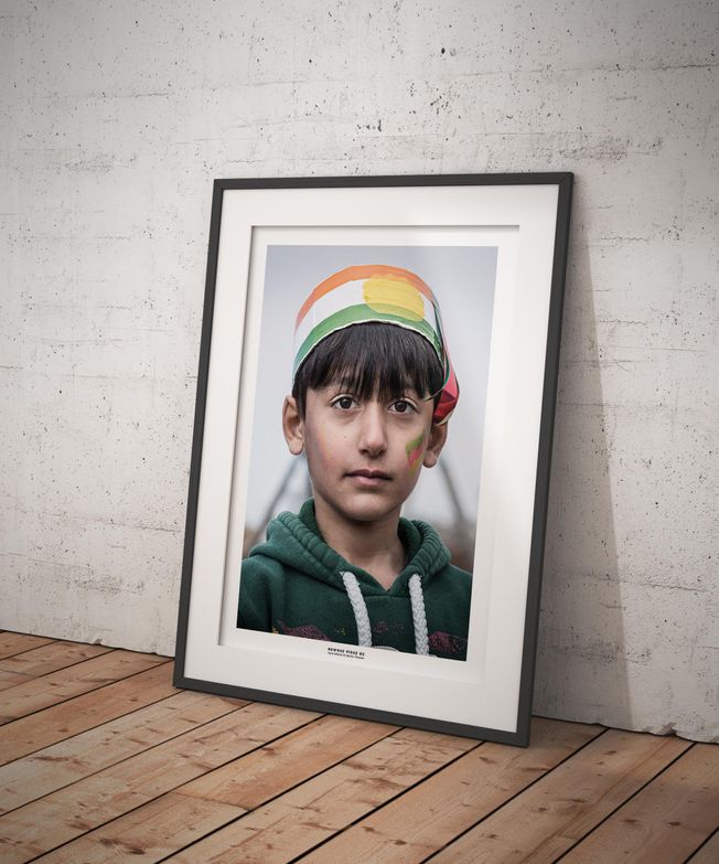 Portrait of a Kurdish boy celebrating Newroz. Photo by photographer Martin Thaulow. Open Edition (seen in a frame in an environment. The frame is not part of sale). Buy high quality print.