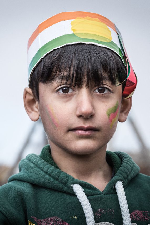 Portrait of a Kurdish boy celebrating Newroz. Photo by photographer Martin Thaulow. Open Edition (seen without the white frame around the image). Buy high quality print.