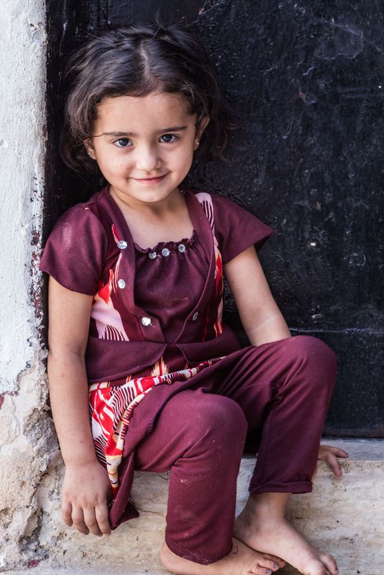 Portrait of a child bride in Amman, Jordan. Married off at the age of 13. Photo by Martin Thaulow.