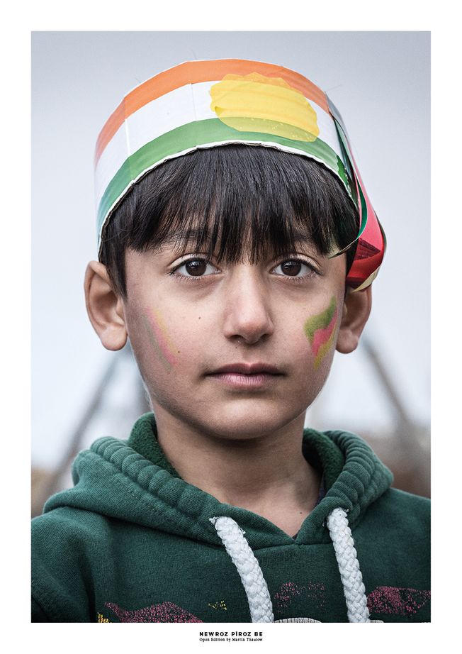 Portrait of a Kurdish boy celebrating Newroz. Photo by photographer Martin Thaulow. Open Edition (seen with the white frame around the image as it is sold). Buy high quality print.