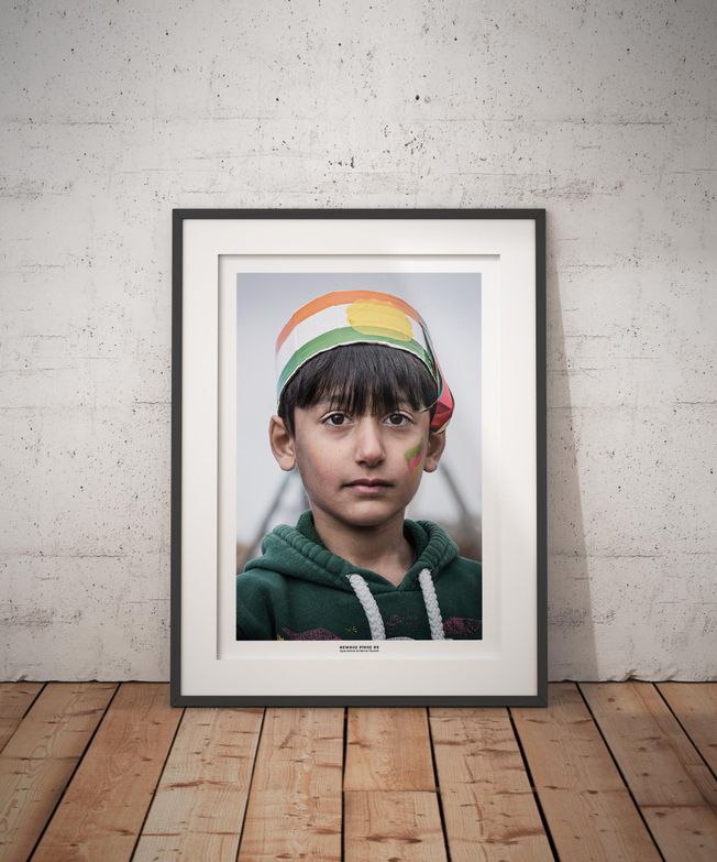 Portrait of a Kurdish boy celebrating Newroz. Photo by photographer Martin Thaulow. Open Edition (seen in a frame in an environment. The frame is not part of sale). Buy high quality print.